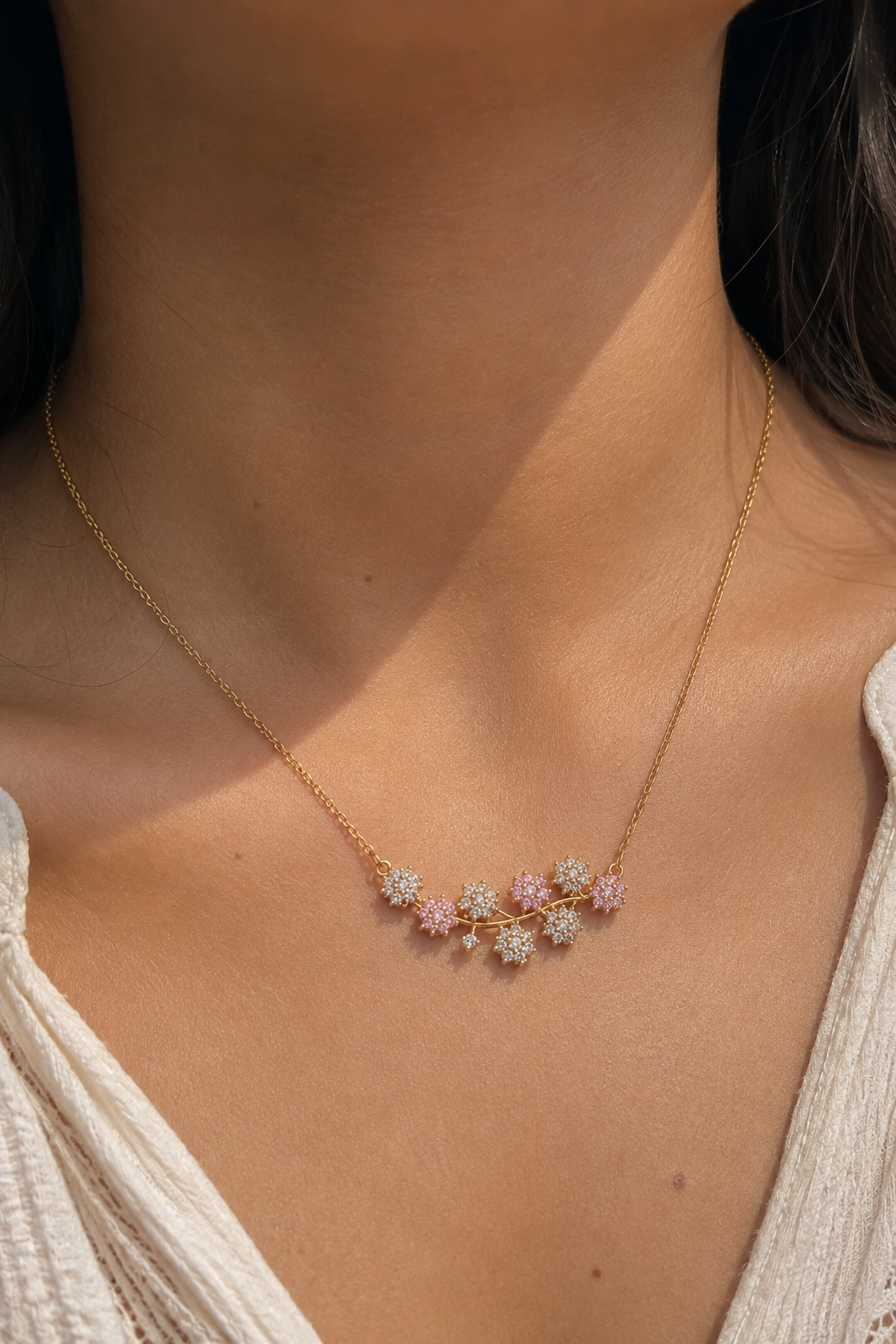 Blush Bloom Necklace worn at the neck, pink stone flower pendant on a fine chain
