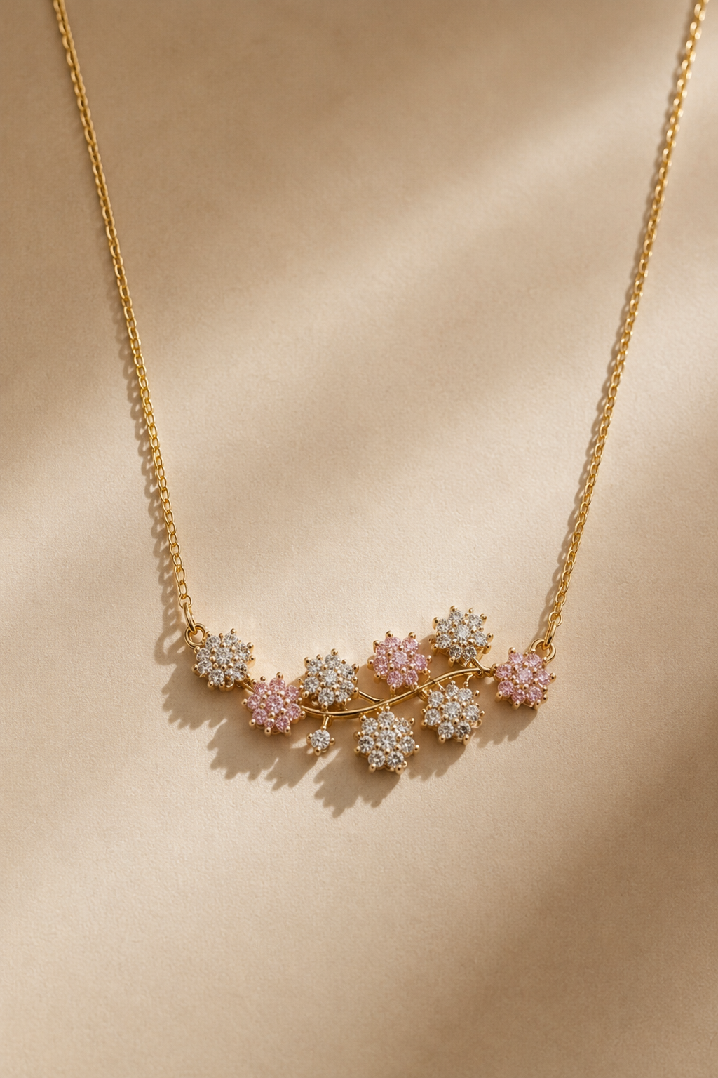 Blush Bloom Necklace pendant and snake chain laid flat