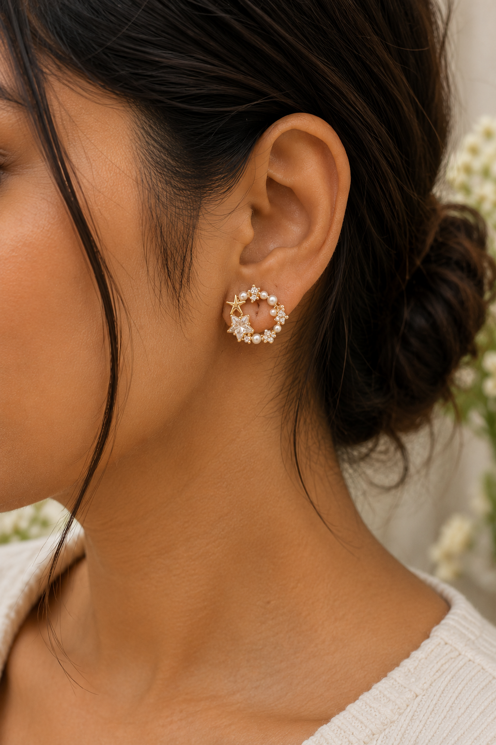 Celestial Pearl Star Earrings worn on the ear, pearl circle with a star at the top