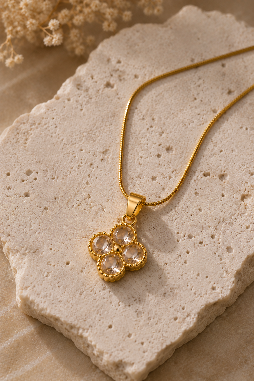 Crystal Clover Necklace, four clear cubic zirconia petals on a gold-tone snake chain