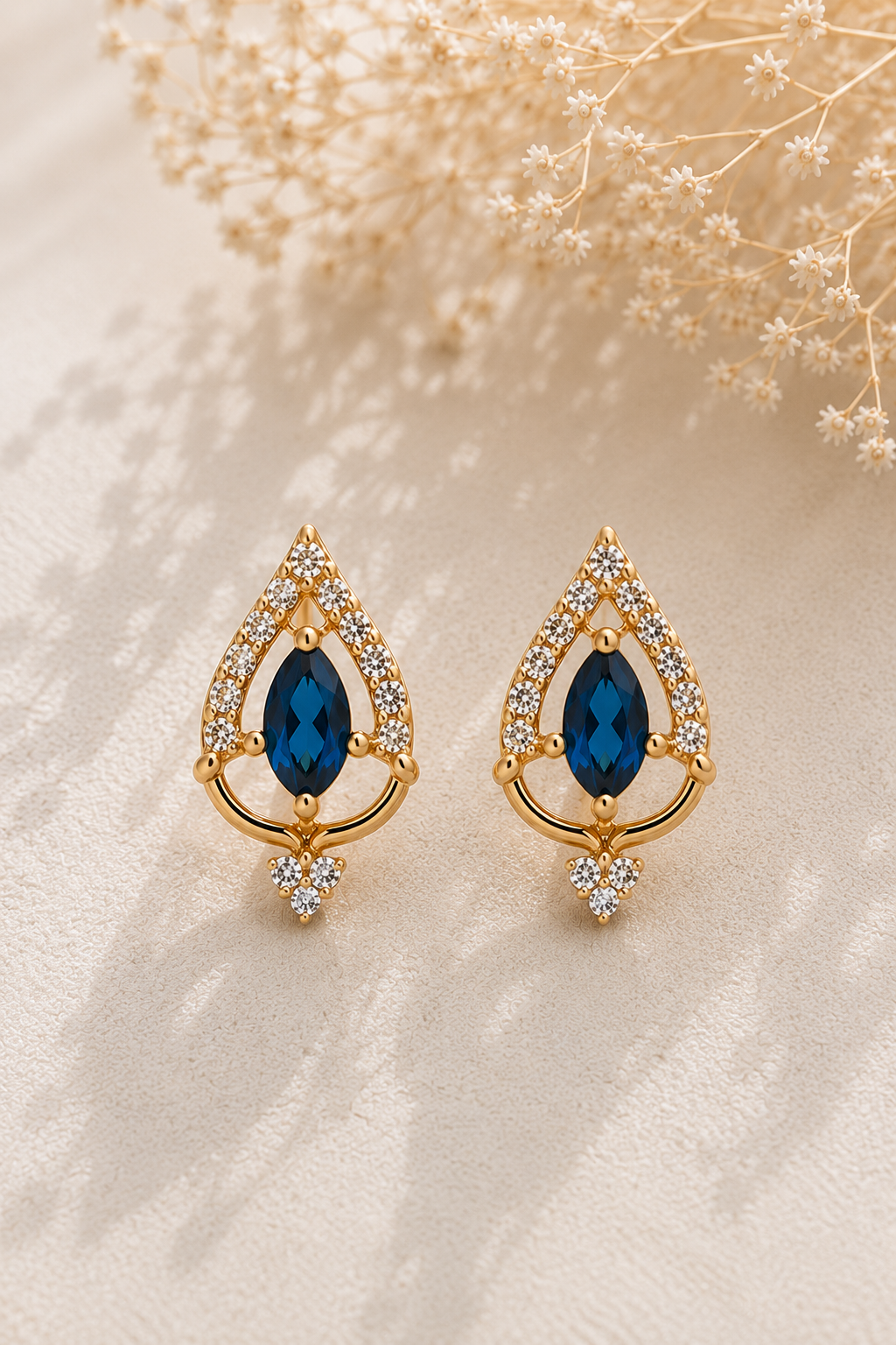Teardrop Sapphire Gold Earrings shown close up